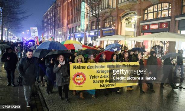 March 2018, Germany, Hamburg: Participants of a demonstration protest against the possible German support of the Turkish military operations in...