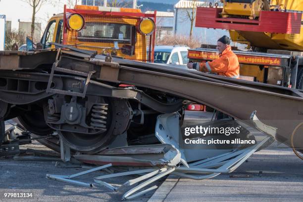 March 2018, Germany, Regensburg: A completely destroyed waggon pictured along a street. A switching engine pushed several waggons into a truck at a...