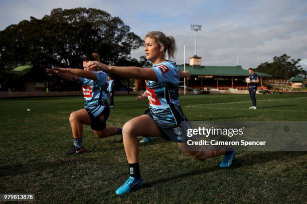 Talesha Quinn of the Blues stretches during the New South Wales women's State of Origin captain's run at North Sydney Oval on June 21, 2018 in...