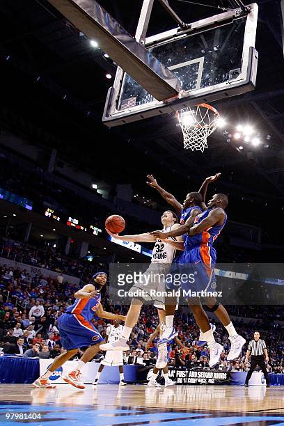Jimmer Fredette of the BYU Cougars drives for a shot attempt against the Florida Gators during the first round of the 2010 NCAA men�s basketball...