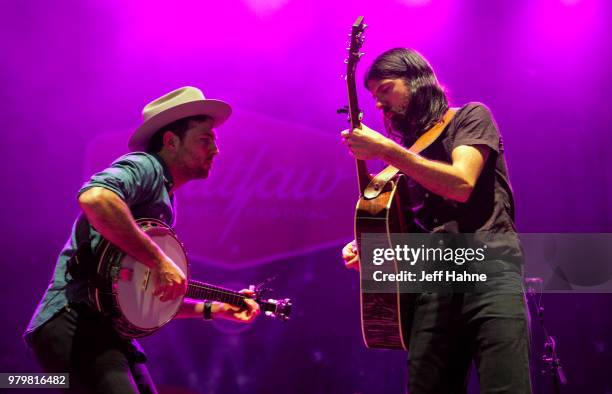 Singer/banjo player Scott Avett and singer/guitarist Seth Avett of The Avett Brothers peform at PNC Music Pavilion on June 20, 2018 in Charlotte,...