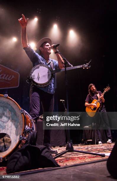 Singer/banjo player Scott Avett and singer/guitarist Seth Avett of The Avett Brothers peform at PNC Music Pavilion on June 20, 2018 in Charlotte,...