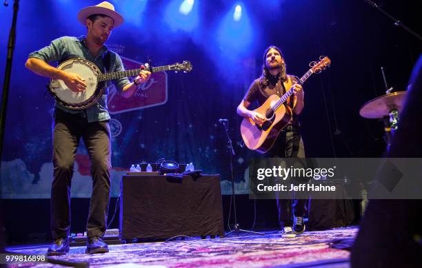 Singer/banjo player Scott Avett and singer/guitarist Seth Avett of The Avett Brothers peform at PNC Music Pavilion on June 20, 2018 in Charlotte,...