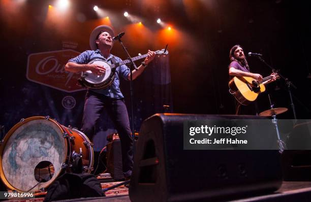 Singer/banjo player Scott Avett and singer/guitarist Seth Avett of The Avett Brothers peform at PNC Music Pavilion on June 20, 2018 in Charlotte,...