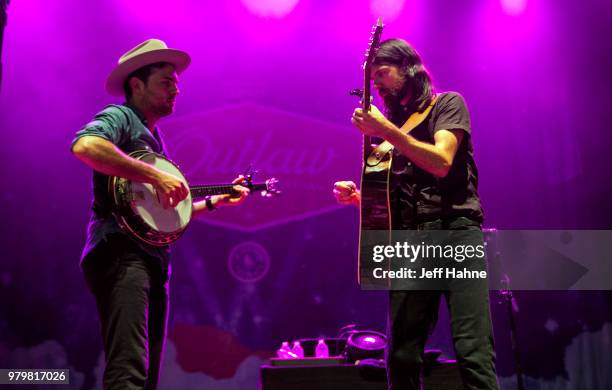 Singer/banjo player Scott Avett and singer/guitarist Seth Avett of The Avett Brothers peform at PNC Music Pavilion on June 20, 2018 in Charlotte,...