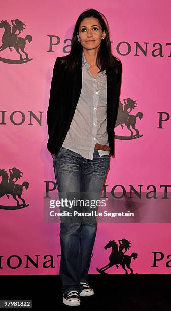 Adeline Blondieau poses during a photocall before the presentation of "The Passionata" collection on March 23, 2010 in Paris, France.