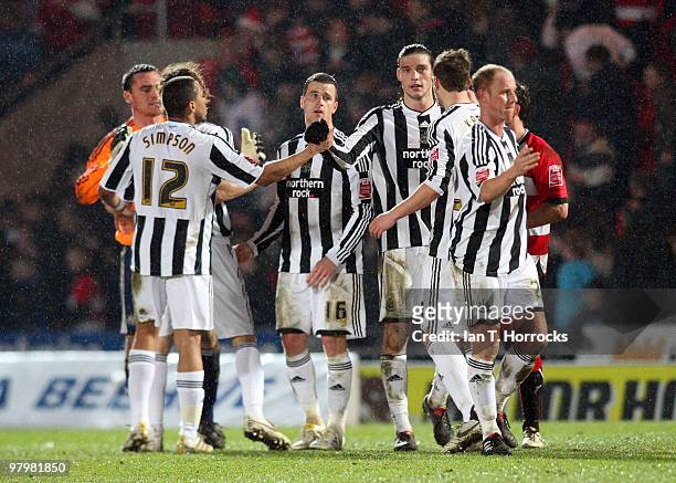 Andy Carroll is congratulated by team mates at the end of the Coca Cola Championship match between Doncaster Rovers and Newcastle United at The...