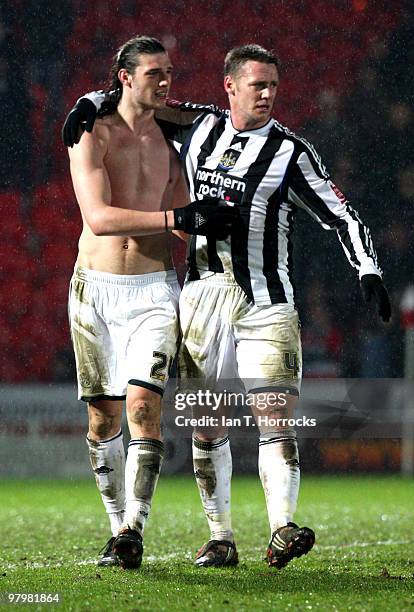 Andy Carroll of Newcastle is congratulated by team mate Kevin Nolan at the end of the Coca Cola Championship match between Doncaster Rovers and...