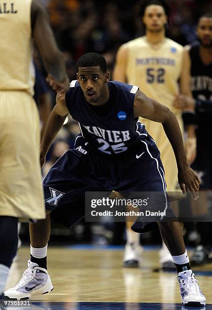 Dante Jackson of the Xavier Musketeers plays defense against a Pittsburgh Panthers player in the second half during the second round of the 2010 NCAA...