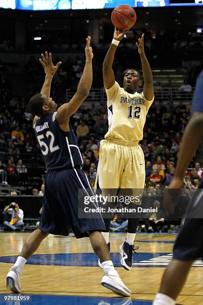 Ashton Gibbs of the Pittsburgh Panthers shoots over Terrell Holloway of the Xavier Musketeers during the second round of the 2010 NCAA men's...