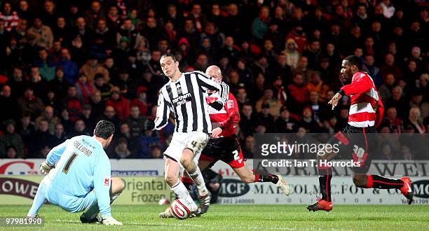 Andy Carroll takes the ball past Neil Sullivan to score the only goal of the Coca Cola Championship match between Doncaster Rovers and Newcastle...