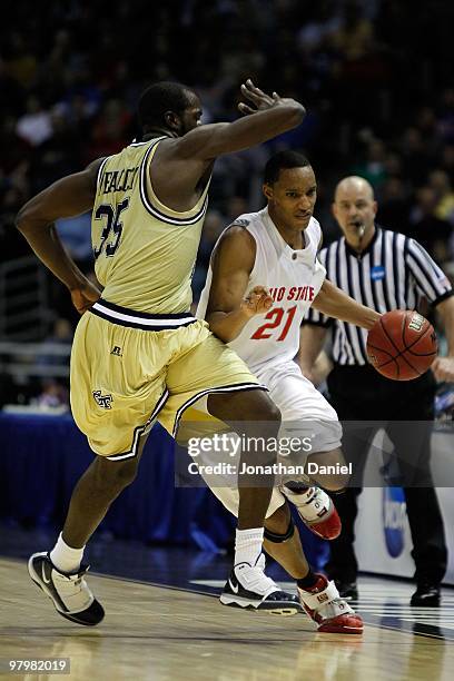 Evan Turner of the Ohio State Buckeyes moves the ball against Zachery Peacock of the Georgia Tech Yellow Jackets during the second round of the 2010...