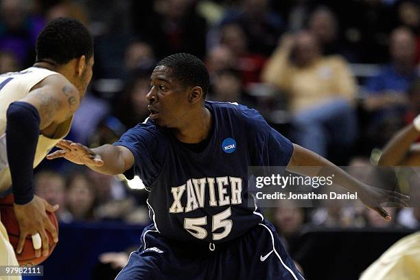 Jordan Crawford of the Xavier Musketeers plays defense against a Pittsburgh Panthers player in the second half during the second round of the 2010...