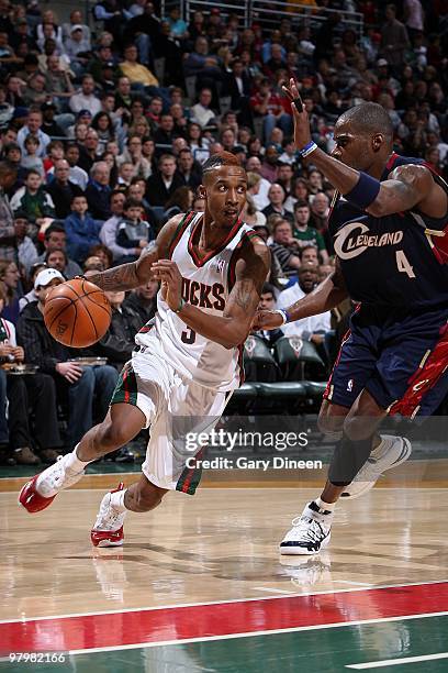 Brandon Jennings of the Milwaukee Bucks drives to the basket against Antawn Jamison of the Cleveland Cavaliers during the game on March 6, 2010 at...