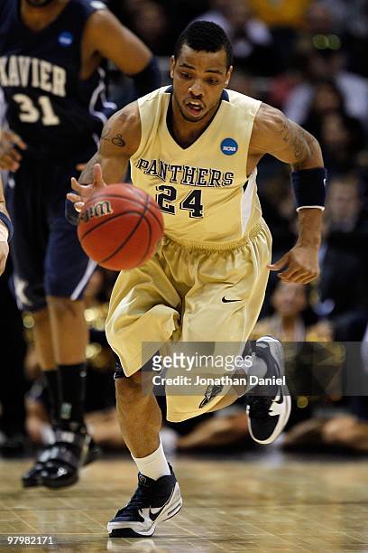 Jermaine Dixon of the Pittsburgh Panthers moves the ball against the Xavier Musketeers during the second round of the 2010 NCAA men's basketball...