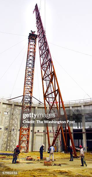 The National Museum of the Marine Corps' signature 210 foot tall mast, which is as tall as the uppermost point of the US Capitol, was lifted into its...