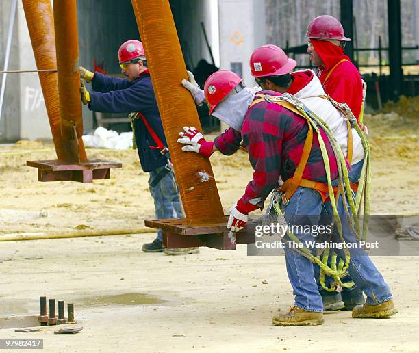 The National Museum of the Marine Corps' signature 210 foot tall mast, which is as tall as the uppermost point of the US Capitol, was lifted into its...