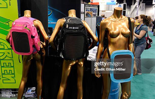 Pair of Capsoul Soular Back-Up Packs and a Soular Piggy Back Back-Up Pack by Neon Green are displayed at the International CTIA Wireless 2010...