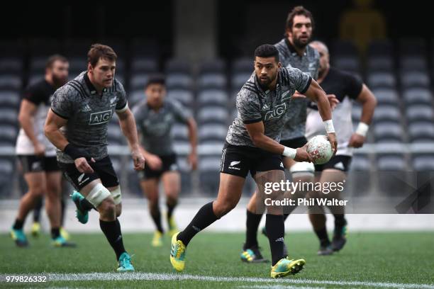 Richie Mo'unga of the All Blacks passes during a New Zealand All Blacks training session at Forsyth Barr Stadium on June 21, 2018 in Dunedin, New...