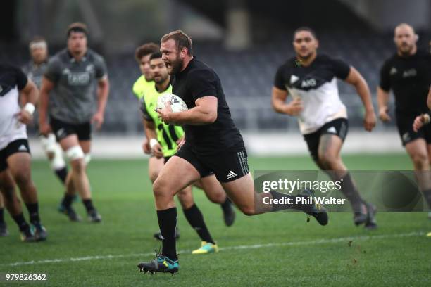 Joe Moody of the All Blacks runs the ball during a New Zealand All Blacks training session at Forsyth Barr Stadium on June 21, 2018 in Dunedin, New...