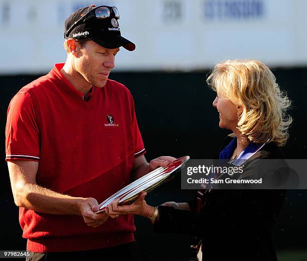 Nick O'Hern of Australia accepts the Payne Stewart Salver Award from Tracy Stewart following the second day's play of the Tavistock Cup at Isleworth...