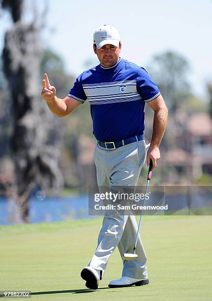 Graeme McDowell of Northern Ireland reacts to a birdie on the ninth hole during the second day's play of the Tavistock Cup at Isleworth Golf and...