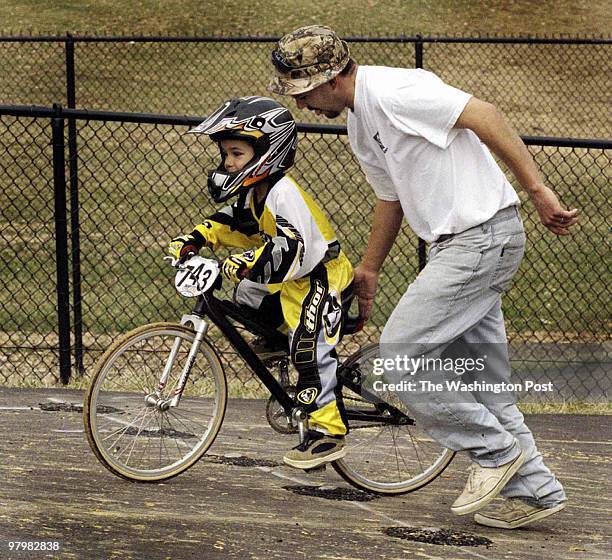Bikes and bodies undulated over hilly terrain at the BMX track located on the grounds of Prince William stadium. The first day race season, which...