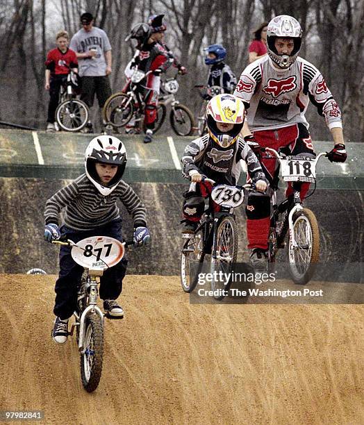 Bikes and bodies undulated over hilly terrain at the BMX track located on the grounds of Prince William stadium. The first day race season, which...