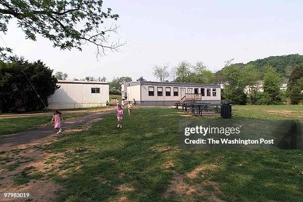 Need photos of headmaster of Loudoun Country Day School, Randy Hollister, showing the area in which the school plans to erect classroom trailers....