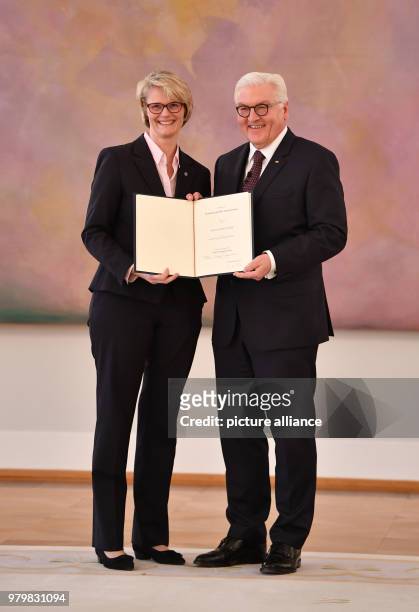 Dpatop - German President Frank-Walter Steinmeier presents a certificate of appointment to Anja Karliczek , German minister for education and...