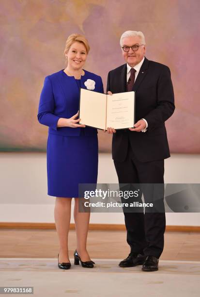 Dpatop - German President Frank-Walter Steinmeier presents a certificate of appointment to Franziska Giffey , German families minister, during the...