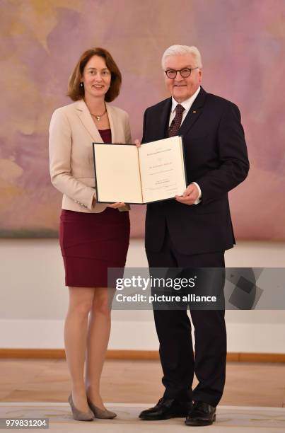 Dpatop - German President Frank-Walter Steinmeier presents a certificate of appointment to Katarina Barley , German justice minister, during the...