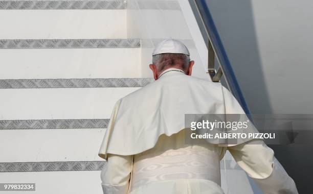 Pope Francis boards a plane to fly from the Fiumicino airport on June 21 to Geneva for a one day pastoral trip.