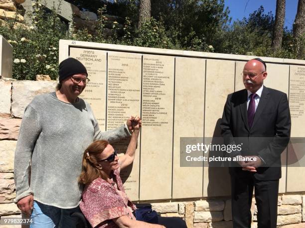 March 2018, Israel, Jerusalem: Arthur Schmidt , grandson of Arthur and Paula Schmidt, holds Ginger Lane's hand at the wall of honour at the Yad...