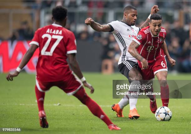 Bayern's Thiago Alcantara and Besiktas' Jeremain Lens vie for the ball during the UEFA Champions League round of 16 second leg soccer match between...