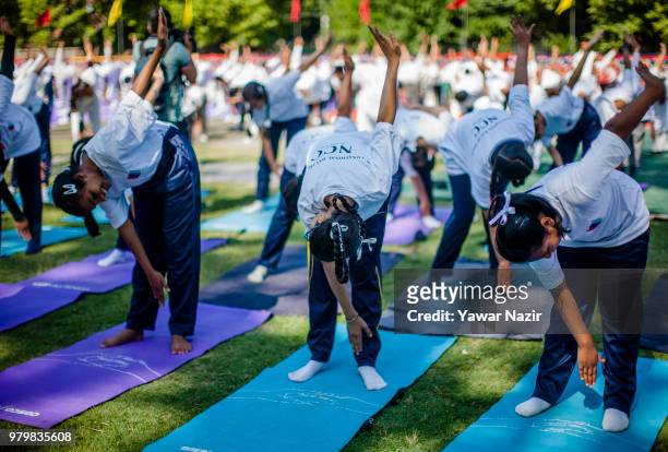 Kashmiri students perform Yoga in a stadium on June 21 in Srinagar, the summer capital of Indian administered Kashmir, India. Yoga, which means union...