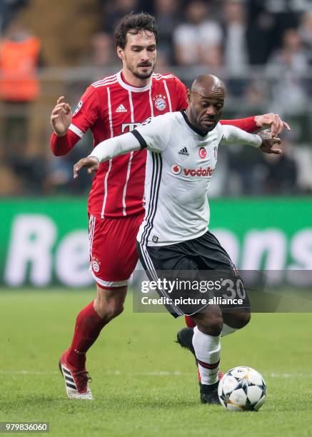 Bayern's Mats Hummels and Besiktas' Vagner Love vie for the ball during the UEFA Champions League round of 16 second leg soccer match between...