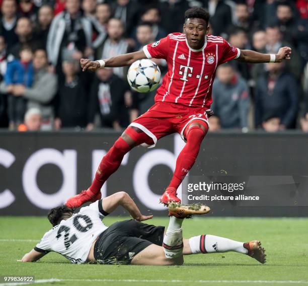 Dpatop - Bayern's David Alaba and Besiktas' Necip Uysal vie for the ball during the UEFA Champions League round of 16 second leg soccer match between...