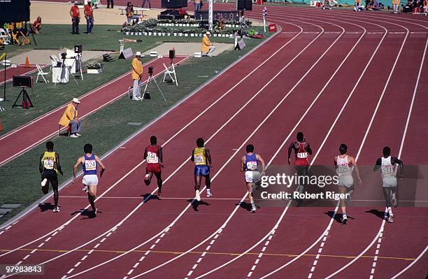 Carl Lewis competes in Heat 2 of the Semifinals of the Men's 200 metres during the 1984 Summer Olympics at Los Angeles Memorial Coliseum on August 8,...