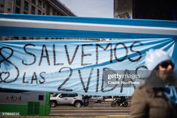 People demonstrate in rejection of the decriminalization of abortion in Buenos Aires, Argentina, on 20 June 2018 with the 'save the two lives'. A...