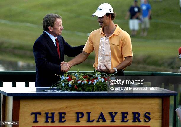 PGAcommissioner Tim Finchem hands Adam Scott the winner's trophy after final-round play at the PGA Tour's Players Championship March 28, 2004.