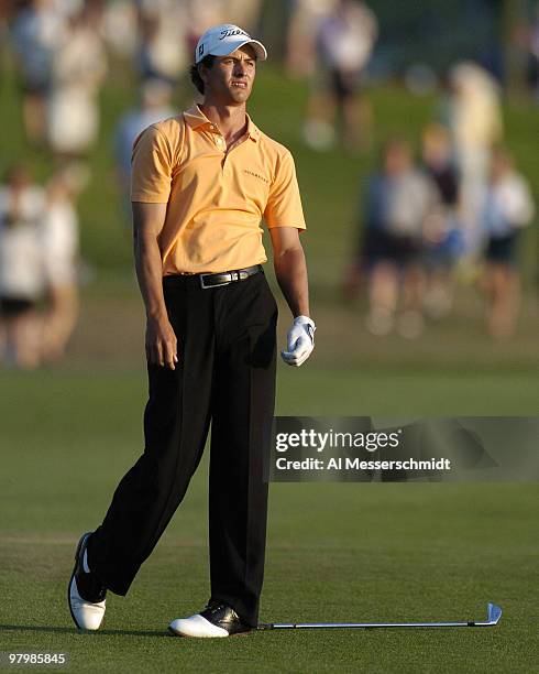 Adam Scott hits his approach shot on the 18th hole into the water during final-round play at the PGA Tour's Players Championship March 28, 2004.