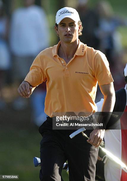 Adam Scott checks a putt during final-round play at the PGA Tour's Players Championship March 28, 2004.