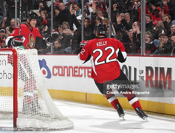 Chris Kelly of the Ottawa Senators celebrates his first period goal against the Philadelphia Flyers with teammate Andy Sutton at Scotiabank Place on...