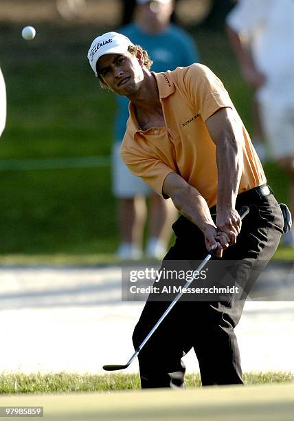 Adam Scott chips during final-round play at the PGA Tour's Players Championship March 28, 2004.