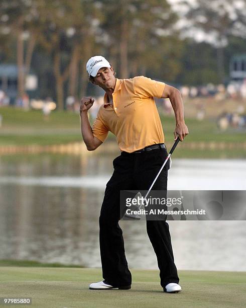 Adam Scott pumps his fist after sinking the winning putt during final-round play at the PGA Tour's Players Championship March 28, 2004.