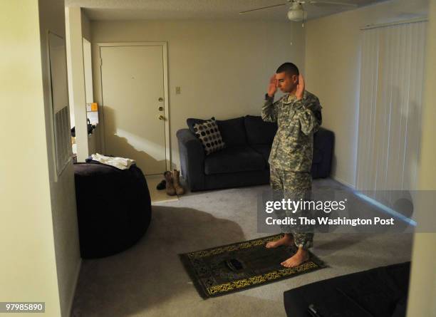 Army Specialist Zachari Klawonn, a Muslim soldier at Fort Hood, performs his evening prayers while still in uniform on March 17 in Killeen, TX. For...