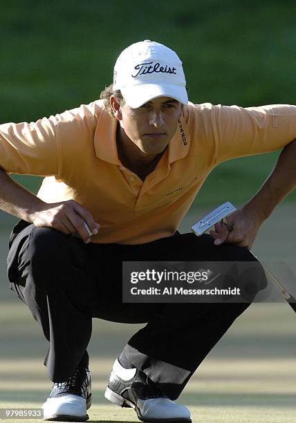 Adam Scott studies a putt during final-round play at the PGA Tour's Players Championship March 28, 2004.