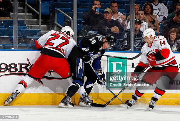 Stephane Veilleux of the Tampa Bay Lightning battles between Brett Carson and Sergei Samsonov of the Carolina Hurricanes at the St. Pete Times Forum...