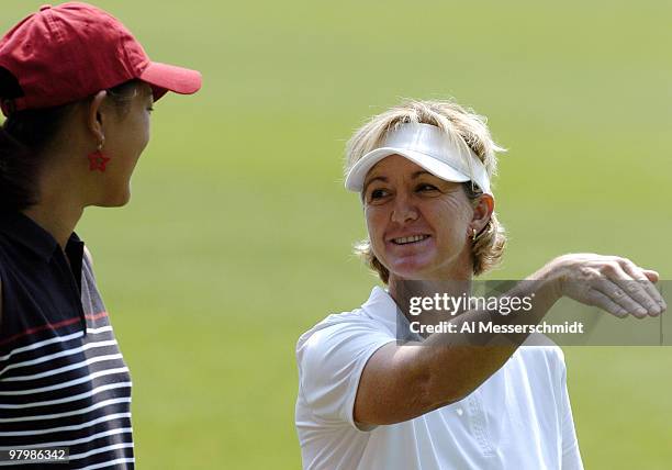 Michelle Wie talks with Hall of Famer Beth Daniel during the final round of the LPGA Michelob Ultra Open in Williamsburg, Virginia, May 9, 2004.